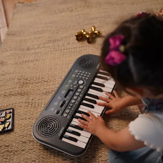 Kid playing a Kadence instrument