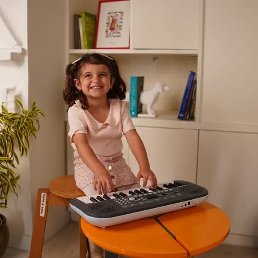 Kid playing a Kadence instrument